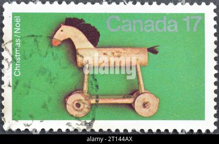 Cancelled postage stamp printed by Canada, that shows Wooden Horse toy, Christmas, circa 1979. Stock Photo