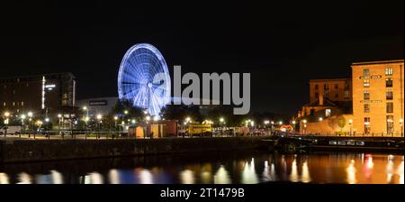 Liverpool, united kingdom May, 16, 2023 Wheel of Liverpool at night in Harbor in Albert Dock as the famous tourism attraction, motion blur Stock Photo