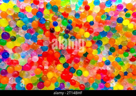 The texture is a lot of different color balls. Set of multi-colored orbeez.Orbeez Water Beads for Play. Many multicolored orbits, helium balls Stock Photo