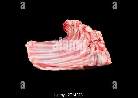 Raw lamb chops isolated on a black background. Raw fresh rack of lamb isolated. Lamb Ribs  Raw Meat  Isolated over black Stock Photo