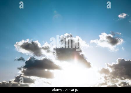 Clouds and sunrays at sunset with blue sky. Religion concept background. Inspirational quotes background photo. Stock Photo