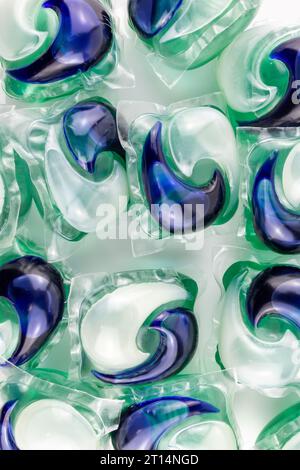 A collection of capsules with detergent for the washing machine isolated on a white background. Stock Photo