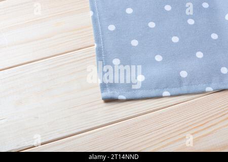 Gray Checkered napkin on wooden background. Stock Photo