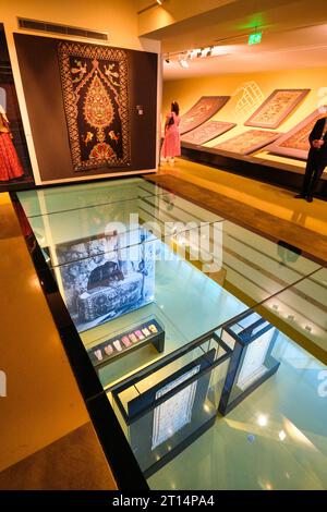 Interior view in the display galleries of various carpets and historic samples, seen through a glass floor. At the Carpet Museum in Baku, Azerbaijan. Stock Photo