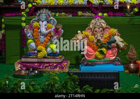 Beautiful idols of Lord Ganesha being worshipped at a mandal in Mumbai for the auspicious Indian festival of Ganesh Chaturthi Stock Photo