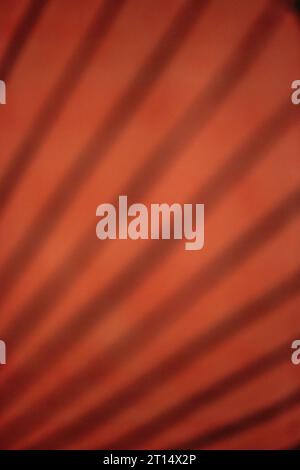 A blurry dreamy view of an orange background crossed with diagonal lines. Stock Photo