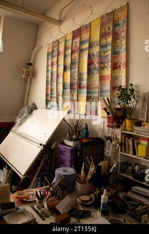 Paintbrushes and other tools in an art studio. Stock Photo