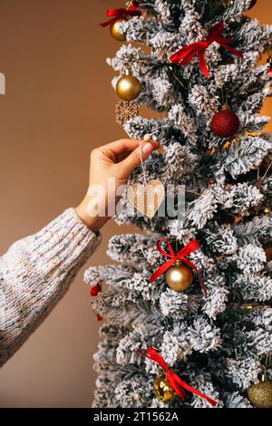 Decorating the Christmas tree. Christmas and New Year preparing. Stock Photo