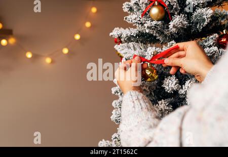 Christmas and New Year preparing. Decorating the Christmas tree. Stock Photo