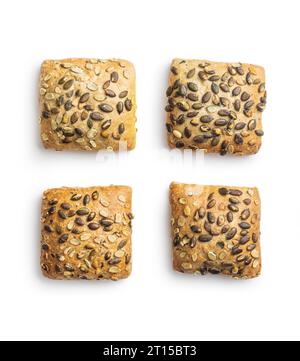 Whole grain bun with pumpkin seeds isolated on the white background. Stock Photo