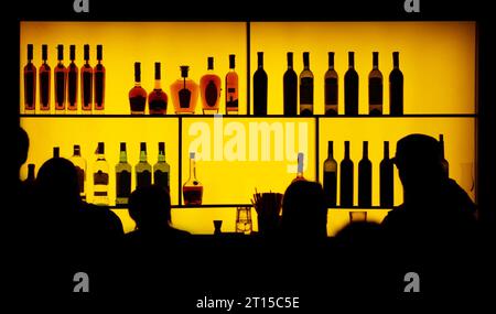 silhouette of people against of a bar in a nightclub Stock Photo