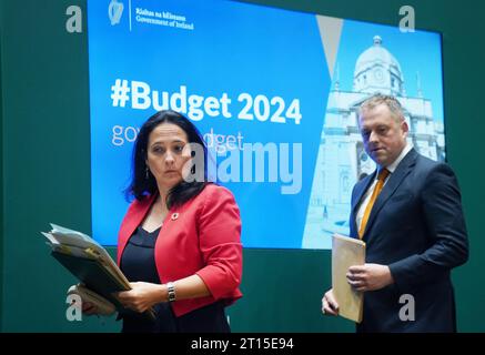 Minister for Tourism, Culture, Arts, Gaeltacht, Sport and Media Catherine Martin (left) and Minister of State at the department Thomas Byrne during a Budget 2024 press conference at Government Buildings in Dublin. Minister Martin has said she is withholding additional funding of 40 million euro from RTE until the broadcaster produces its strategic vision for reform. Picture date: Wednesday October 11, 2023. Stock Photo