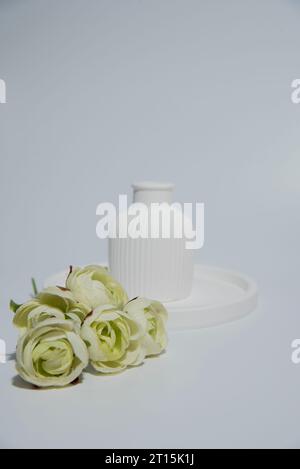 Small white ceramic vase.handmade symbolic ceramic figurines Stock Photo