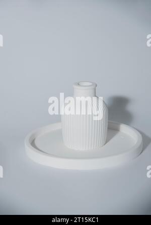 Small white ceramic vase.handmade symbolic ceramic figurines Stock Photo