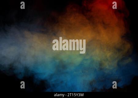 Blue and yellow steam on a black background. Copy space. Stock Photo