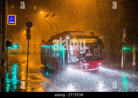1.09.2018. Hungary, Budapest. Solaris Trollino 12 in heavy rain at night. Stock Photo