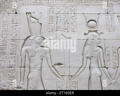 Cloe-up of relief carving of Horus and Hathor in the Ancient Egyptian Temple of Edfu, built in the Ptolemaic period on the west bank of the Nile. Stock Photo