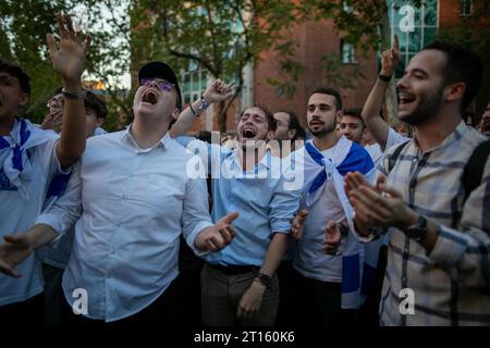 Madrid, Spain. 10th Oct, 2023. A group of young protesters chant slogans during the pro-Israeli event held in front of the Israeli embassy in Madrid. A total of 500 people gathered at the Israeli embassy in Madrid to protest on the Hamas terrorist attack carried out every day. (Photo by David Canales/SOPA Images/Sipa USA) Credit: Sipa USA/Alamy Live News Stock Photo