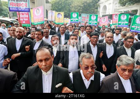 Dhaka, Bangladesh. 11th Oct, 2023. Pro-BNP lawyers gather in a protest and formed a human chain in front of the Supreme Court demanding the BNP (Bangladesh Nationalist Party) Chairperson Khaleda Zia's constitutional right to receive advanced treatment abroad be confirmed, in Dhaka, Bangladesh, October 11, 2023. Khaleda Zia was sent to Old Dhaka Central Jail she was convicted in the Zia Orphanage Trust graft case by a lower court on February 8, 2018. On March 25, 2020, the BNP chief was released from jail upon an executive order on some conditions considering her age and humanitarian ground Stock Photo