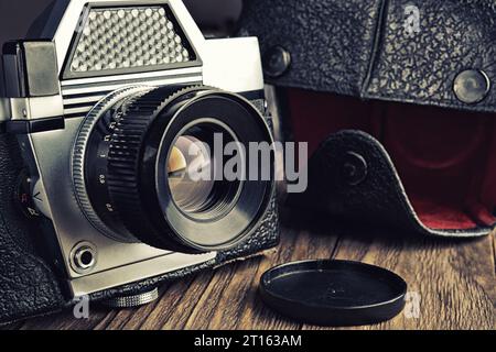 Old vintage photo camera and black leather case Stock Photo