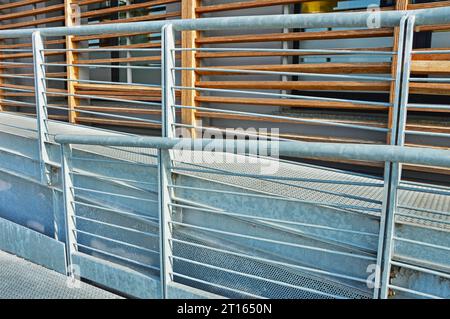 Unusual wooden fence with parallel horizontal rails and vertical posts ...