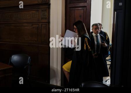 Reggio Calabria, Catanzaro, Italy. 11th Oct, 2023. Magistrates seen while entering in the room. The Court of Appeal of Reggio Calabria, guided by magistrate Elisabetta Palumbo, sentenced the former pro-migrant mayor Domenico Lucano to 1 year and six months of reclusion, with suspended pena. In October 2021, Lucano was sentenced by the Court of Locri to 13 years and two months of reclusion, for fraud and mismanagement of funds for migrants. (Credit Image: © Valeria Ferraro/ZUMA Press Wire) EDITORIAL USAGE ONLY! Not for Commercial USAGE! Stock Photo