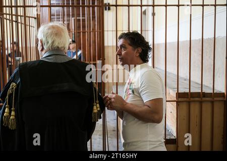 Reggio Calabria, Catanzaro, Italy. 11th Oct, 2023. People seen in the Court of Appeal. The Court of Appeal of Reggio Calabria, guided by magistrate Elisabetta Palumbo, sentenced the former pro-migrant mayor Domenico Lucano to 1 year and six months of reclusion, with suspended pena. In October 2021, Lucano was sentenced by the Court of Locri to 13 years and two months of reclusion, for fraud and mismanagement of funds for migrants. (Credit Image: © Valeria Ferraro/ZUMA Press Wire) EDITORIAL USAGE ONLY! Not for Commercial USAGE! Stock Photo