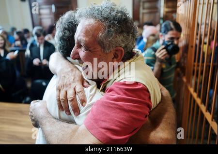 Reggio Calabria, Catanzaro, Italy. 11th Oct, 2023. People seen embtacing after the verdict. The Court of Appeal of Reggio Calabria, guided by magistrate Elisabetta Palumbo, sentenced the former pro-migrant mayor Domenico Lucano to 1 year and six months of reclusion, with suspended pena. In October 2021, Lucano was sentenced by the Court of Locri to 13 years and two months of reclusion, for fraud and mismanagement of funds for migrants. (Credit Image: © Valeria Ferraro/ZUMA Press Wire) EDITORIAL USAGE ONLY! Not for Commercial USAGE! Stock Photo