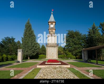 Bilecik clock tower at sunset. It is located in the garden of Bilecik Municipality Palace. Stock Photo