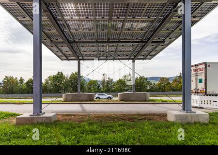 Solar roof on the A81 motorway at the Hegau-Ost service area. The roof spans the slip road to the motorway, the passage is blocked. Under scientific Stock Photo