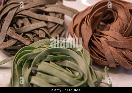 Three different pasta nests uncooked Stock Photo