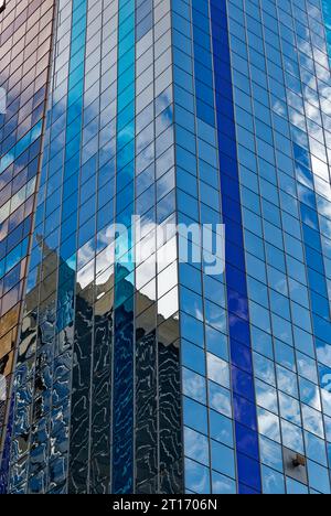 Westin New York at Times Square reflects sky and surroundings in its boldly colored glass curtain walls; stripes accentuate the hotel’s height. Stock Photo