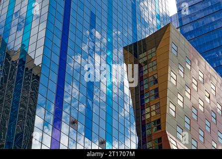 Westin New York at Times Square reflects sky and surroundings in its boldly colored glass curtain walls; stripes accentuate the hotel’s height. Stock Photo