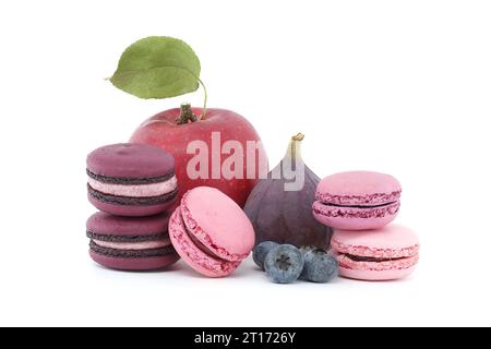 Vibrant scene of fruits and sweet meringue based macarons isolated on white background Stock Photo
