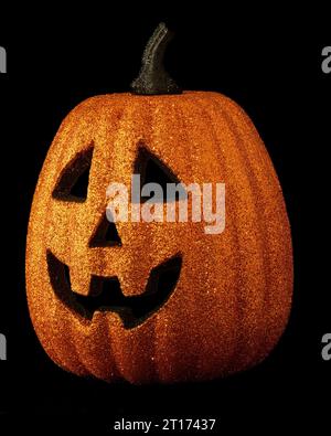 Jack o Lantern isolated on a black background with light inside Stock ...