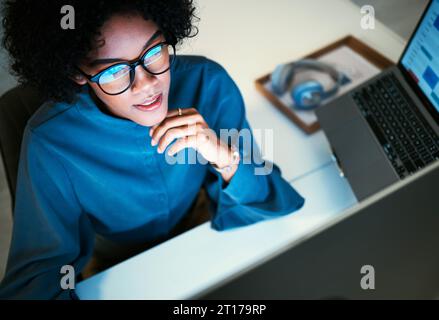 Woman with computer, thinking and spreadsheet for schedule, agenda or reminder in office administration. Online calendar, diary and girl at desk Stock Photo