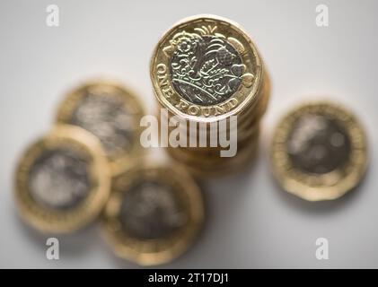 File photo dated 26/01/2018 of British one pound coins. The UK's economy grew slightly in August, with the country's service sector leading the way, the Office for National Statistics has said. Gross domestic product (GDP) increased by 0.2% over the month, in line with what economists had expected. Issue date: Thursday October 12, 2023. Stock Photo