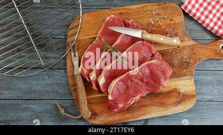 raw beef ribeye close-up on a cutting board Stock Photo