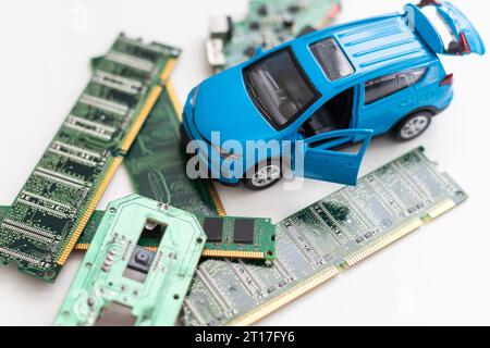 Toy car with CPU. The shortage of microchips and semiconductors creates a shortage of new cars. Conceptual image for semiconductor shortage disrupting Stock Photo