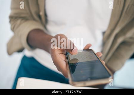 Person, hand and phone for social media, communication or online networking at office. Closeup of employee on mobile smartphone for chatting, texting Stock Photo