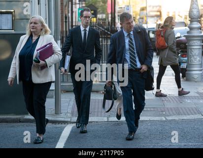 (left to right) RTE director of legal affairs and group secretary Paula Mullooly, acting deputy-general Adrian Lynch and RTE director general Kevin Bakhurst arriving at Leinster House in Dublin to appear before the Public Accounts committee. Picture date: Thursday October 12, 2023. Stock Photo