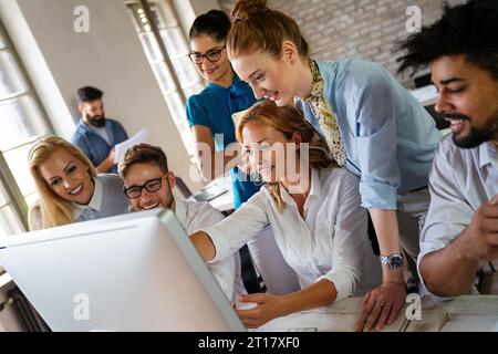 Group of business people and software developers working as a team in office Stock Photo