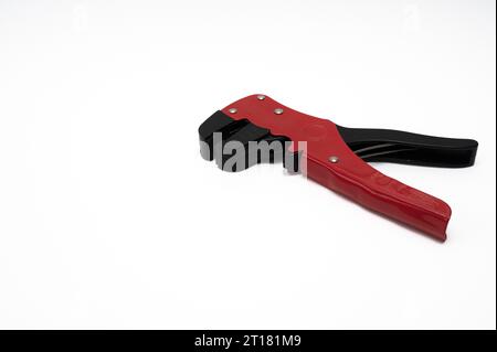 wire stripper with red and black handles isolated on white with copyspace Stock Photo