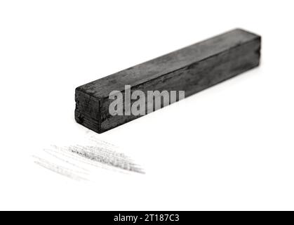 Solid graphite stick art material isolated on white background Stock Photo