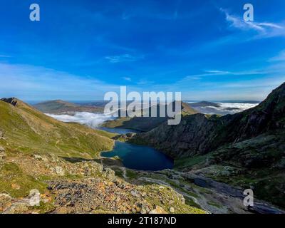 Low cloud above lakes Glaslyn and Llyn Llydaw seen from the Pyg Track in the Snowdonia National Park. UK Stock Photo