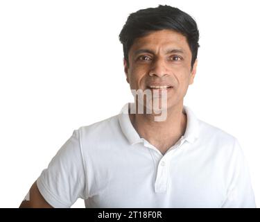 A smart middle-aged fit Indian man in a white t-shirt - studio shot. Looking surprised Stock Photo