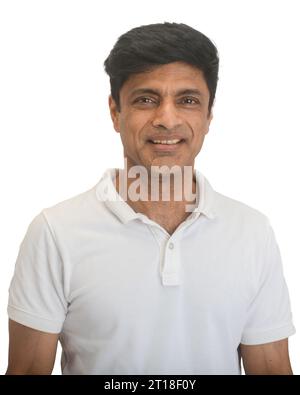 A smart middle-aged fit Indian man in a white t-shirt - studio shot Stock Photo