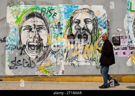 Beirut, Lebanon: A wall is painted with graffiti of screaming people at Martyrs' Square in downtown Beirut Stock Photo