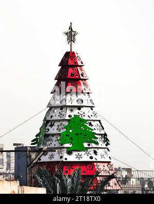 Lebanese red and white with green cedar tree, national symbol of the  Lebanon, on a tree-like tower in the City of Beirut, Lebanon Stock Photo