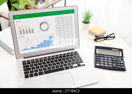 Analyzing data for marketing plan. Business analytics, spreadsheet app on laptop Stock Photo